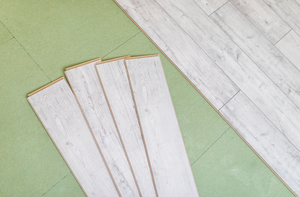 Laminate flooring in a modern living room showing realistic wood texture and durable finish